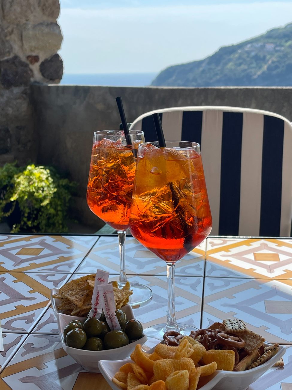 A drink and small plates overlooking the coast